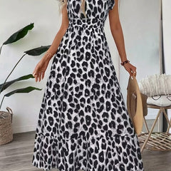 Maxi abito leopardo bianco e nero con scollo a V e maniche arricciate