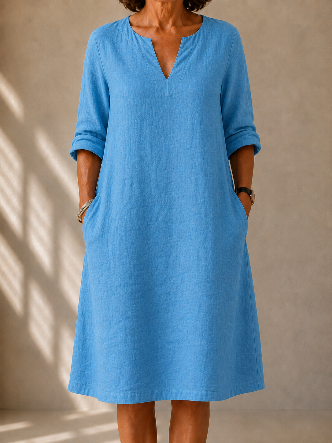 Blue V-neck midi dress with three-quarter sleeves, relaxed fit