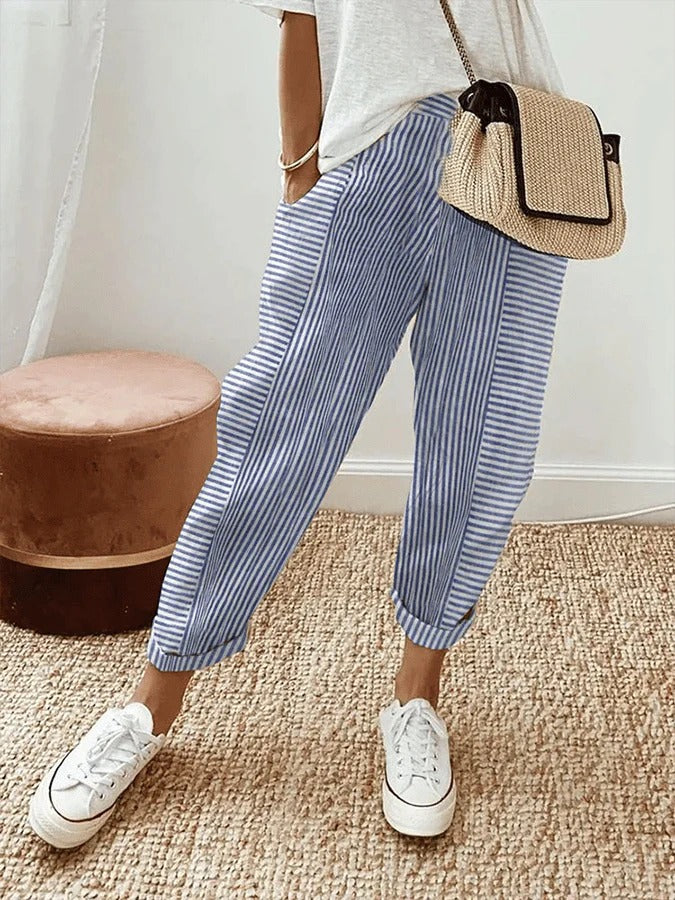 Lightweight blue pinstripe trousers with relaxed fit and cuffed ankle hem