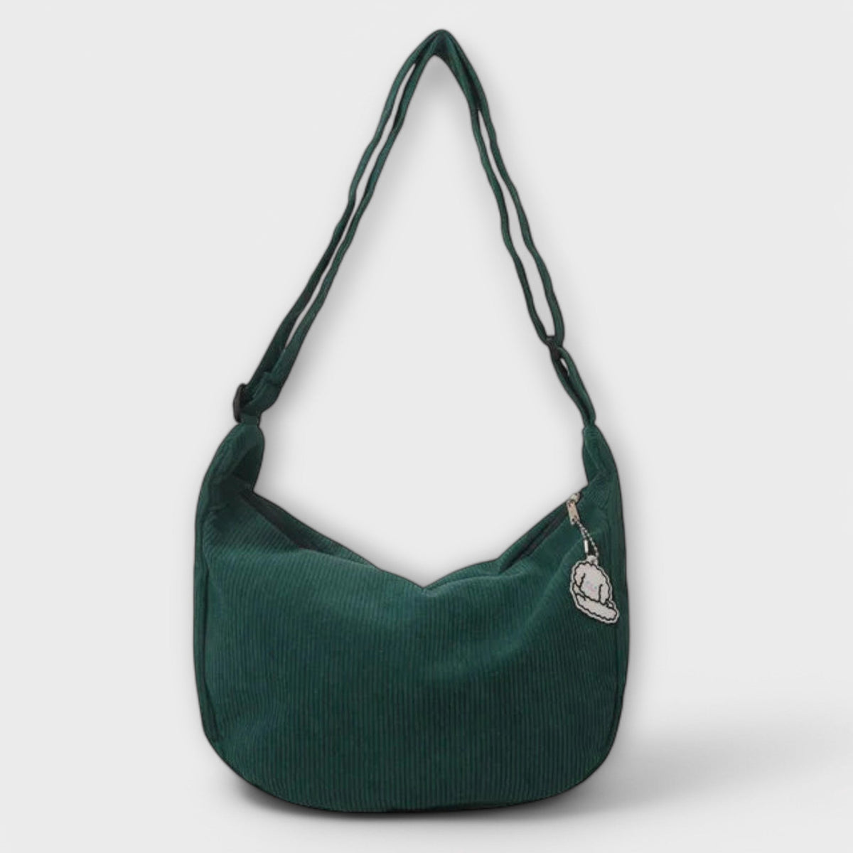 Alexa women’s shoulder bag, deep green corduroy hobo shape with cloud charm patch