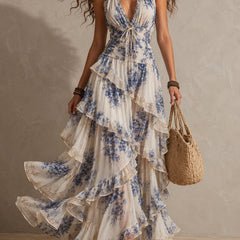 Blue and white floral halter ruffle maxi dress with tied waist and layered skirt