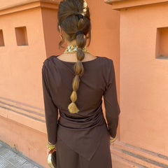 Back view of long-sleeve maxi dress with draped back and waist tie, dark brown