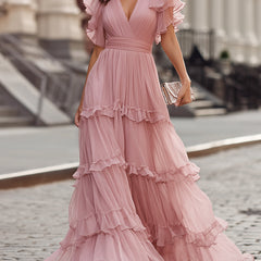 Pink ruffled tiered maxi dress with V-neck bodice and flutter sleeves, full layered skirt