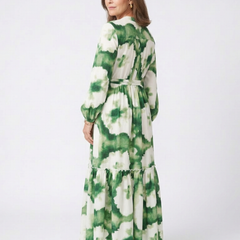 Back view of green-and-white tie-waist tiered maxi dress with long sleeves and floral print