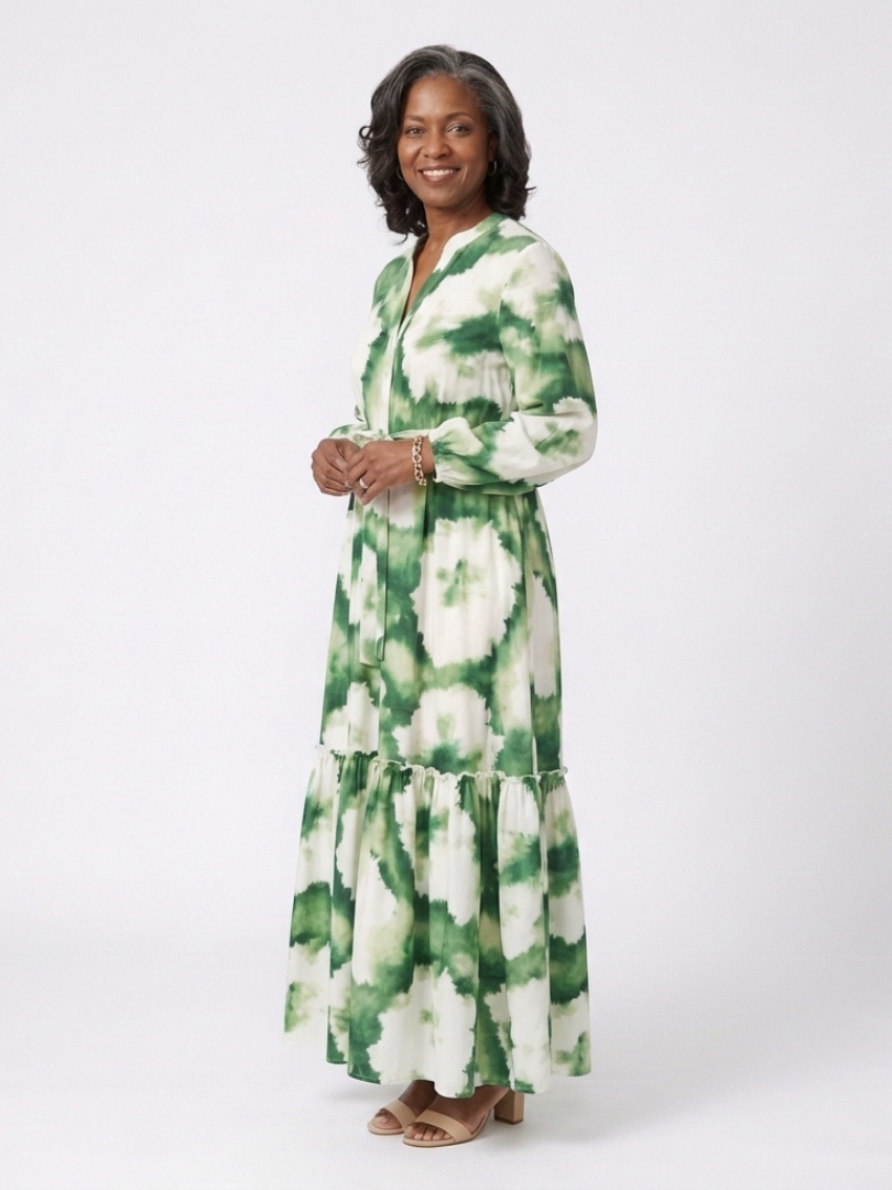 Green-and-white tie-waist tiered maxi dress with long sleeves and floral print
