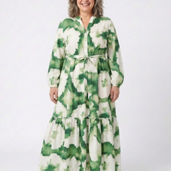 Green-and-white tie-waist tiered maxi dress with long sleeves and V-neck floral print