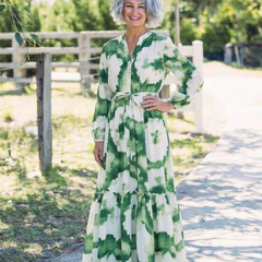 Green-and-white tie-waist tiered maxi dress with long sleeves and tiered floral print