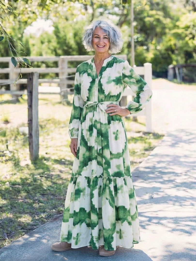 Green-and-white tie-waist tiered maxi dress with long sleeves and tiered floral print