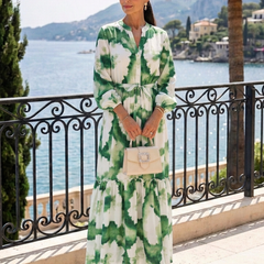 Green-and-white tie-waist tiered maxi dress with long sleeves and floral print