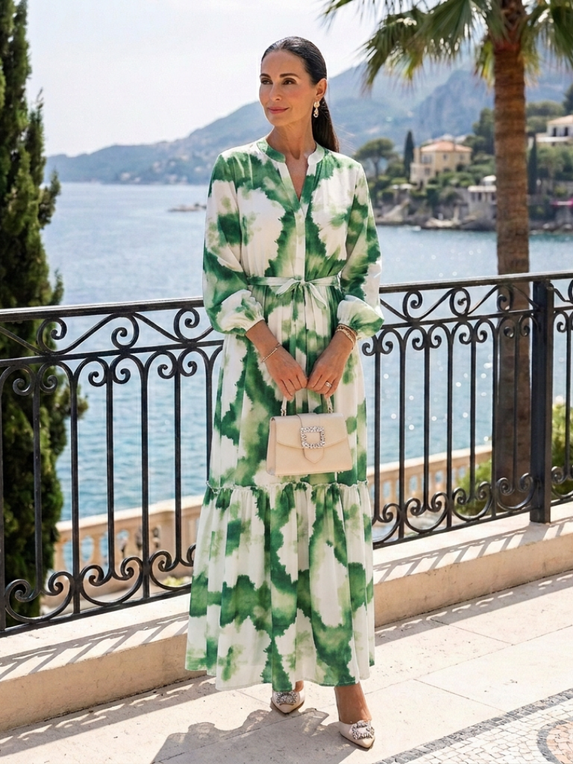 Green-and-white tie-waist tiered maxi dress with long sleeves and floral print