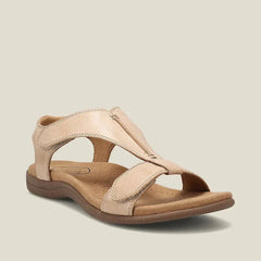 Sandali beige con doppio cinturino regolabile e suola marrone, profilo laterale