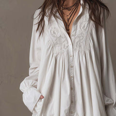 White lace mini shirt dress with V-neck, embroidered yoke, button front, long sleeves