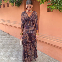 Leaf-print wrap maxi dress with long sleeves, V-neck, and gathered waist belt