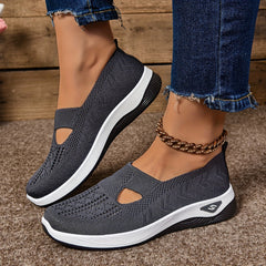 Scarpe antiscivolo in maglia grigio scuro, suola bianca e trafori laterali