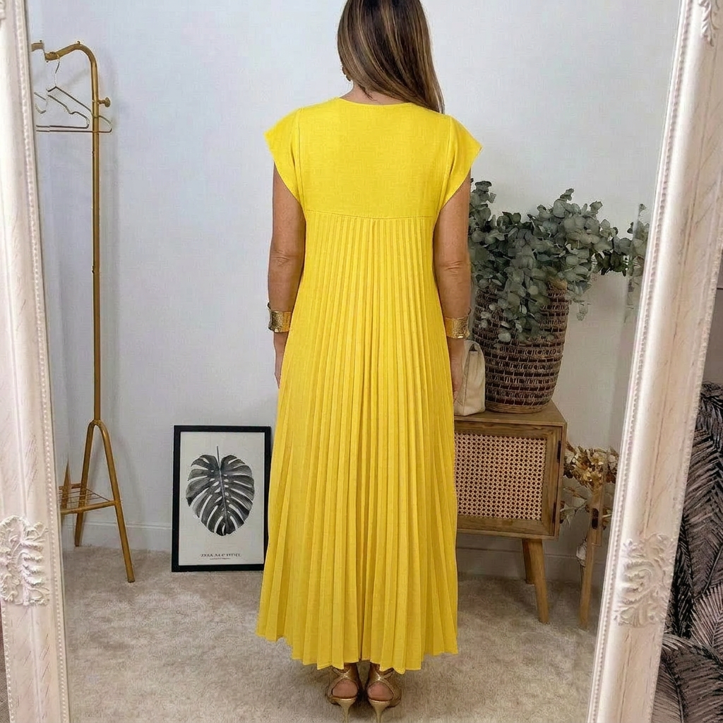 Abito lungo senza maniche giallo plissé con schiena dritta e fondo svasato