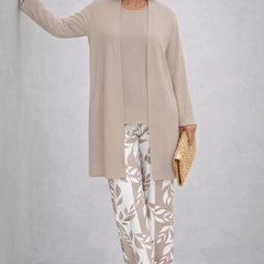 Beige three-piece trouser set with long tunic and white leaf-print pants