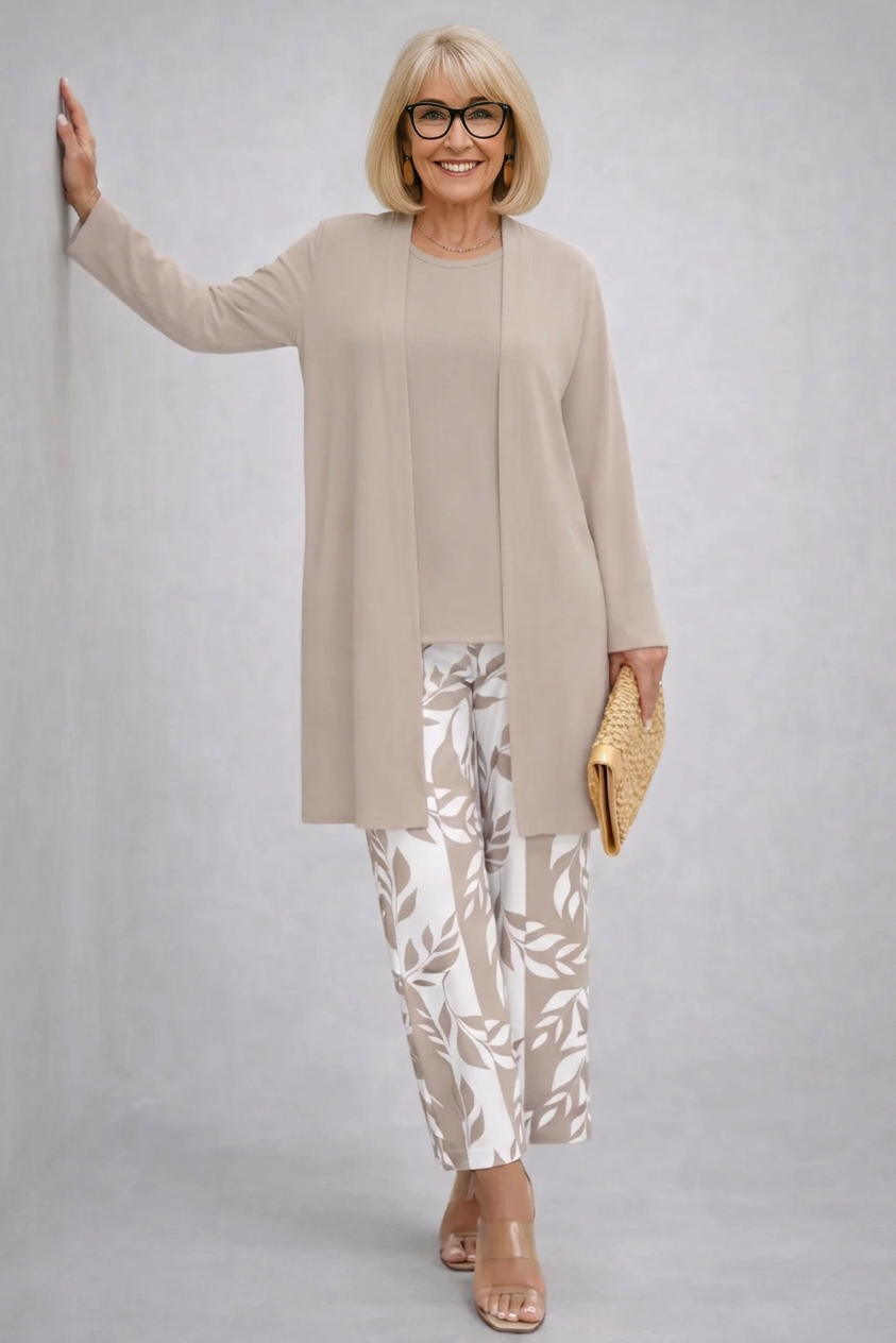 Beige three-piece trouser set with long tunic and white leaf-print pants