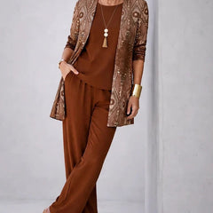 Rust brown three-piece trouser set with bronze shimmer jacket and matching top and trousers