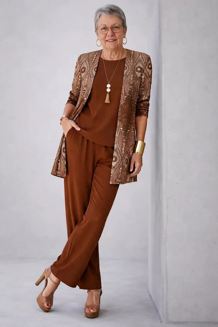Rust brown three-piece trouser set with bronze shimmer jacket and matching top and trousers