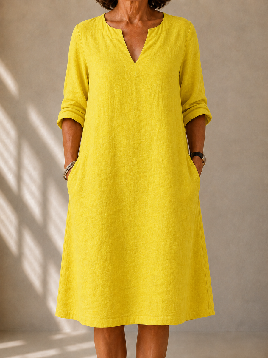 Yellow relaxed V-neck midi dress with 3/4 sleeves and side pockets