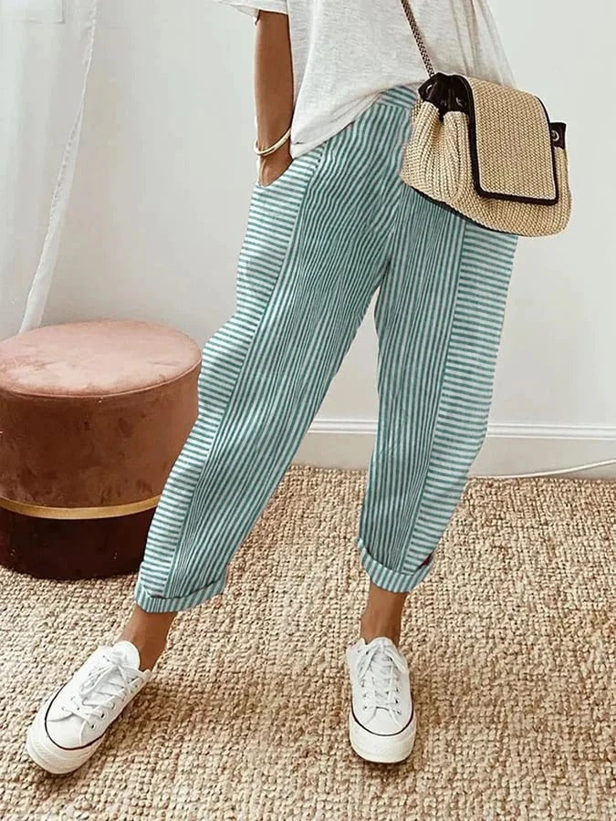 Classic striped trousers, green with white vertical stripes and cuffed hems