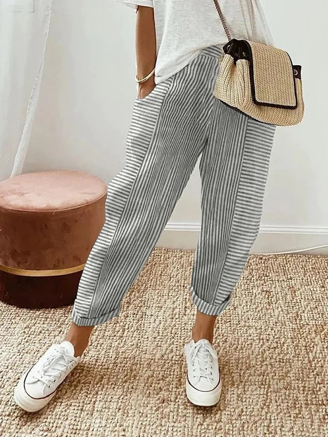 Classic striped trousers, light grey with white vertical stripes and cuffed hems