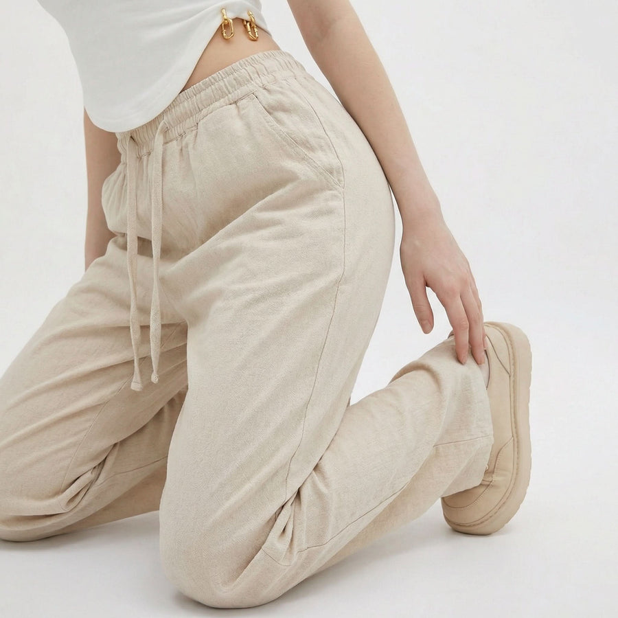 Light khaki linen pants with elastic waist and drawstring, loose relaxed fit