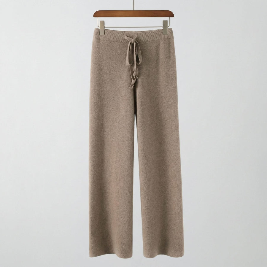 Light knit pants in taupe brown with elastic waistband and tied drawstring.