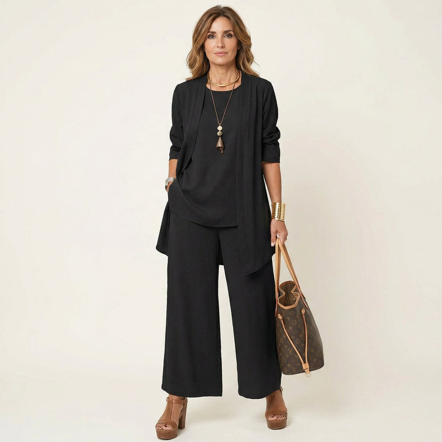 Black three-piece minimalist set with tunic, jacket, and wide-leg pants