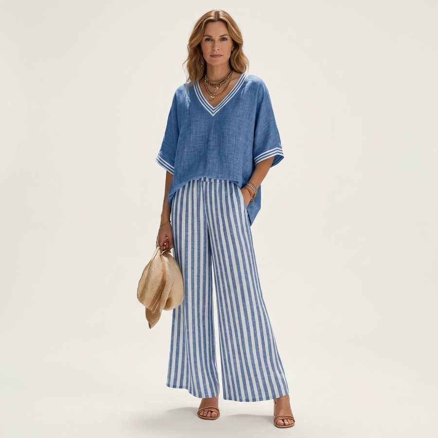 Blue V-neck varsity top and striped wide-leg pants set with contrast trim.