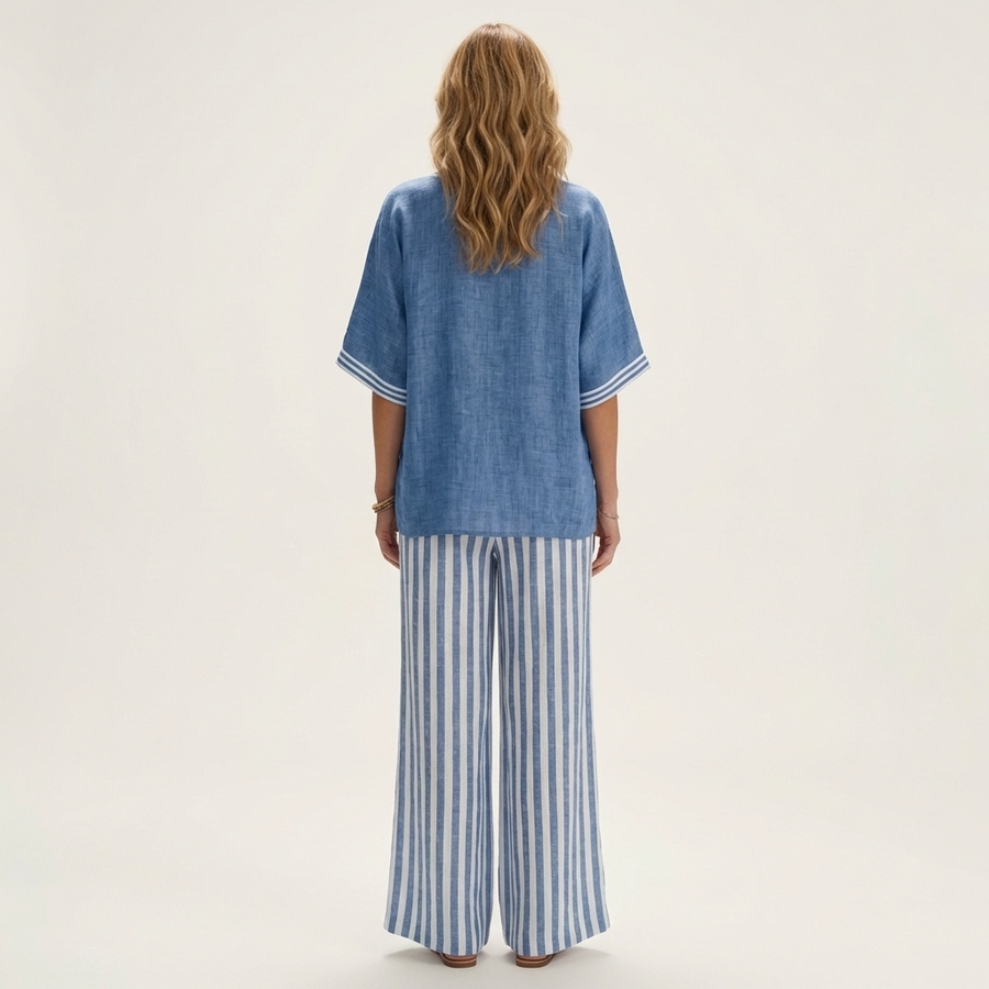 Blue V-neck varsity top and striped wide-leg pants set, back view.