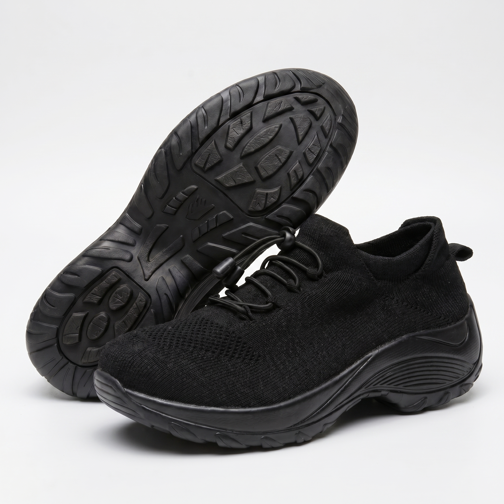 Scarpe comfort ortopediche nere con tomaia in tessuto e lacci neri, suola scolpita