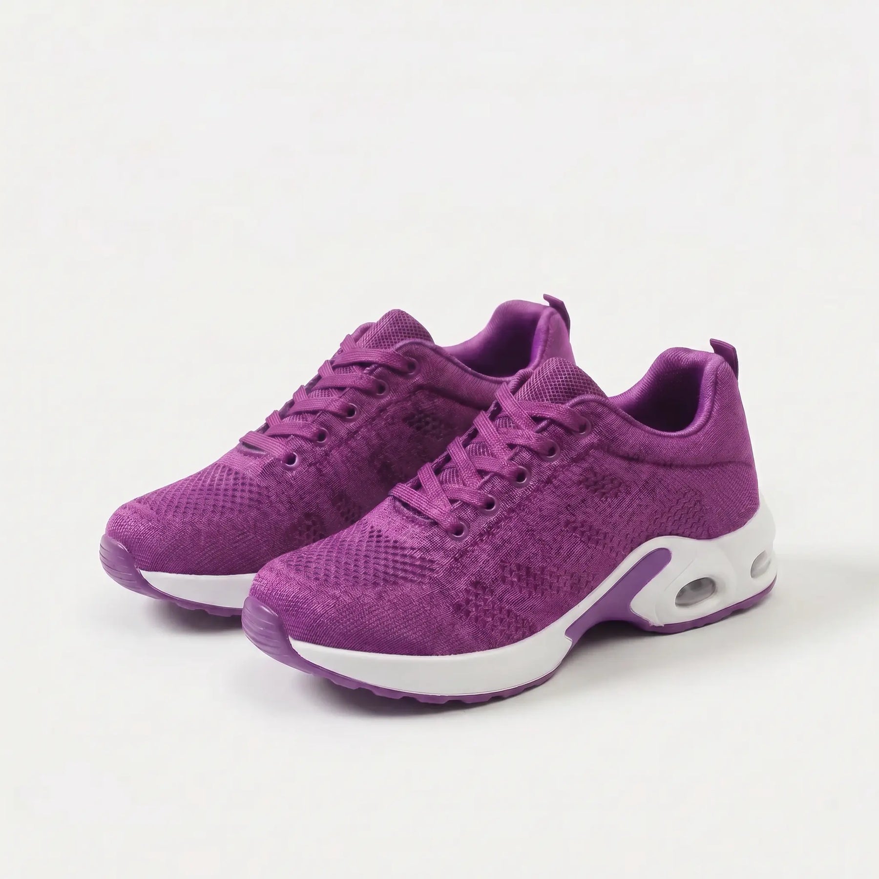 Scarpe ergonomiche viola con suola bianca, stringate e dettagli ammortizzati