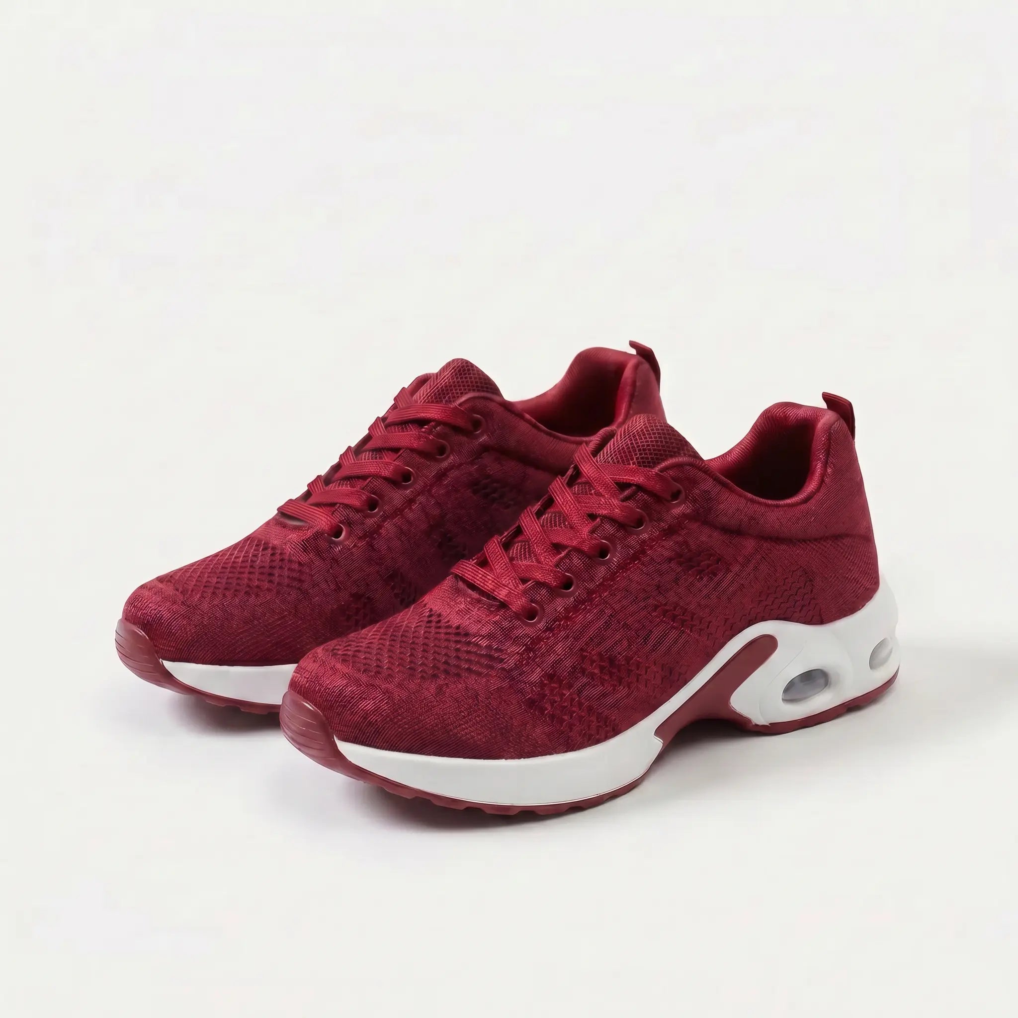 Scarpe ergonomiche rosse con suola bianca, stringate e supporto ammortizzato