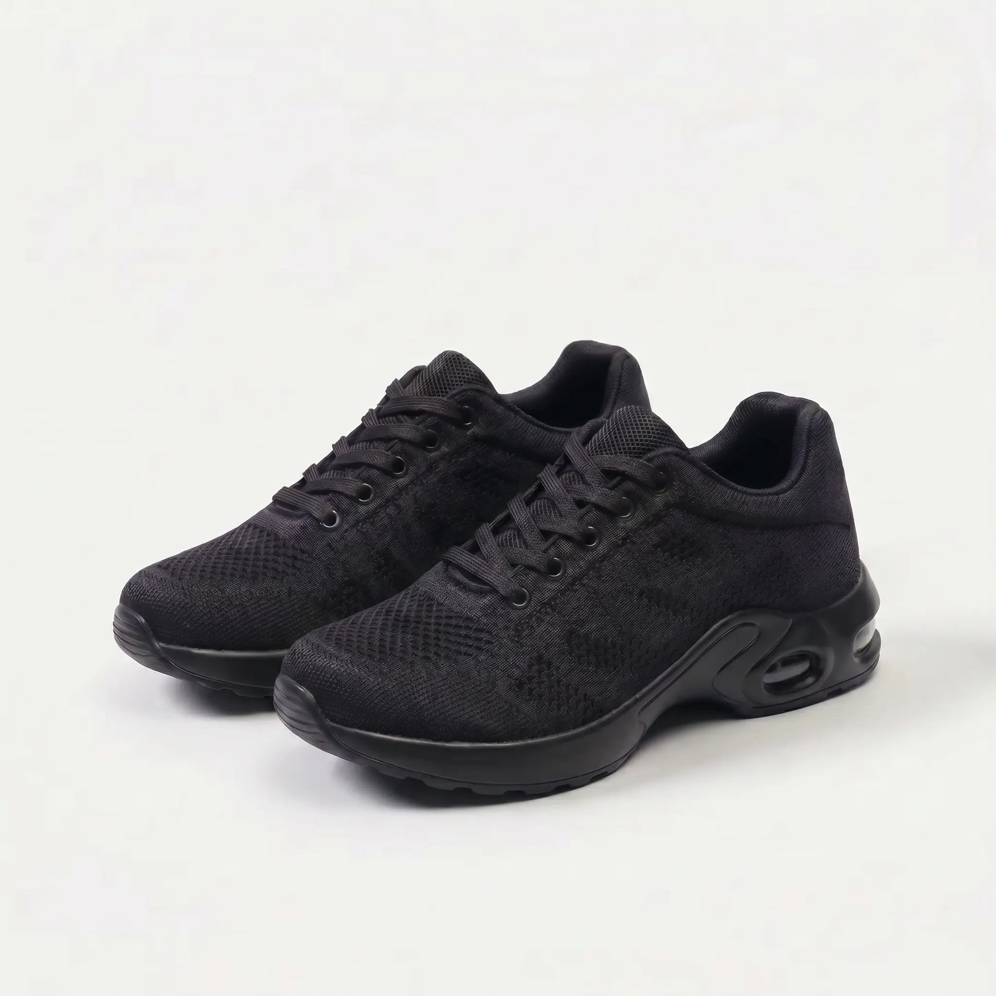 Scarpe ergonomiche nere con suola bianca, stringate e pannelli ammortizzati