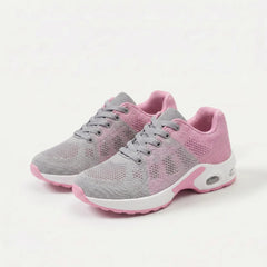 Scarpe ergonomiche grigie con dettagli rosa, lacci e suola bianca ammortizzata