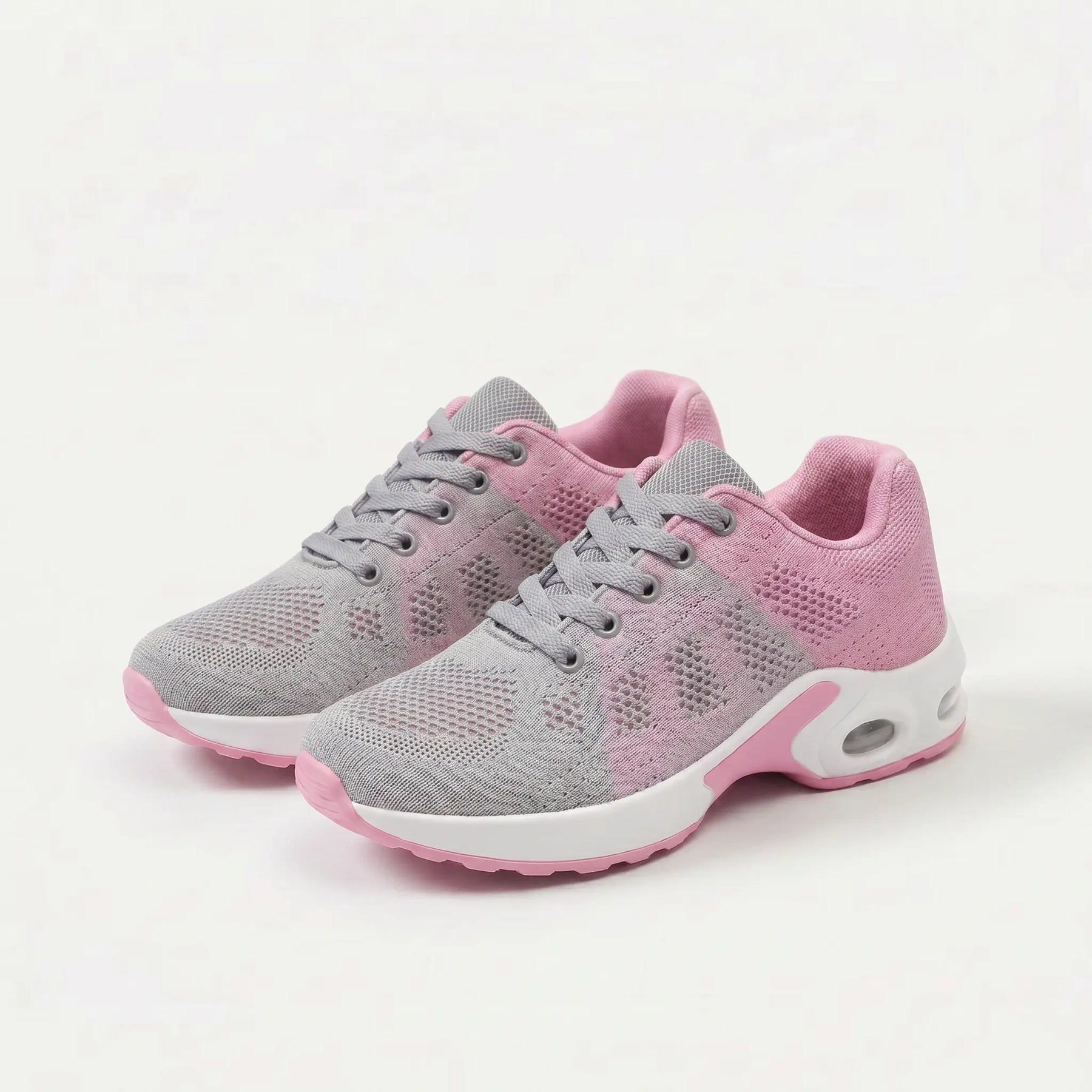 Scarpe ergonomiche grigie con dettagli rosa, lacci e suola bianca ammortizzata
