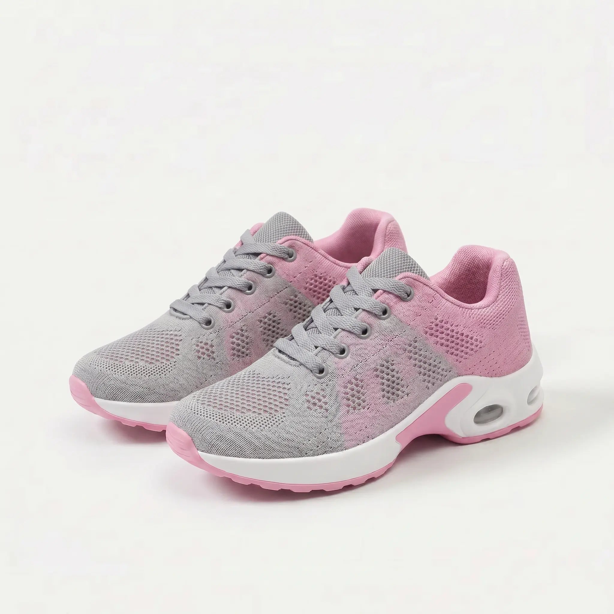 Scarpe ergonomiche grigie con dettagli rosa e suola bianca, stringate