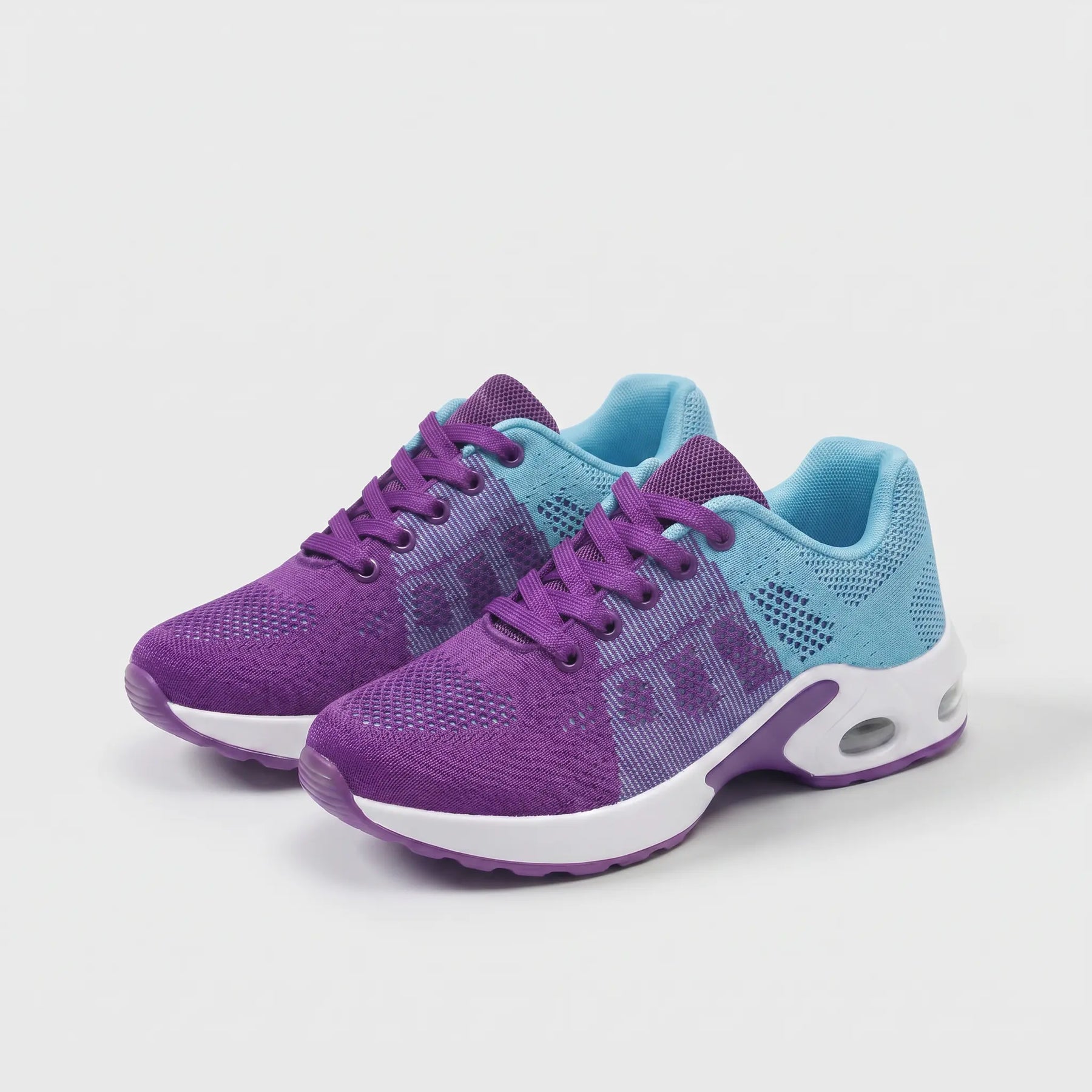 Scarpe ergonomiche viola e azzurro con suola bianca, stringate e inserti