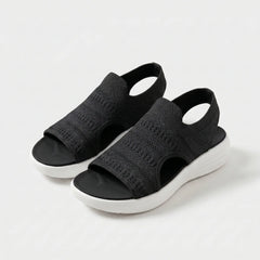 Sandali comfort neri con tomaia in maglia traforata e suola bianca