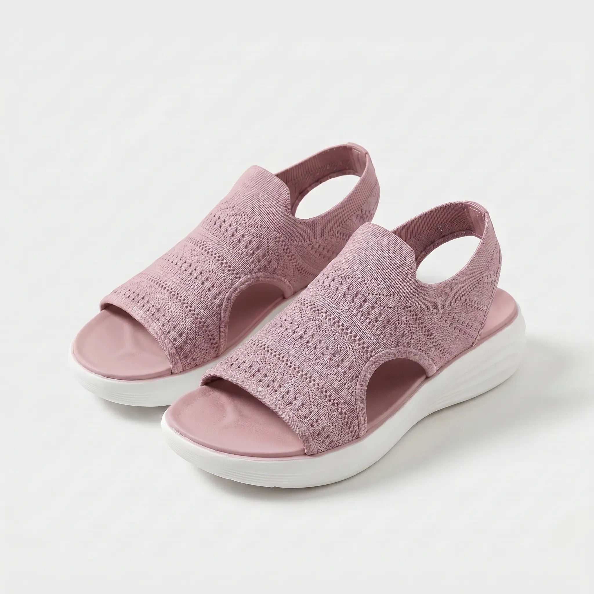 Sandali comfort rosa con tomaia in maglia traforata e suola bianca