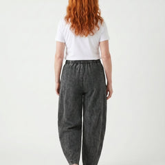 Dark grey relaxed elastic-waist denim trousers, back view with wide straight legs