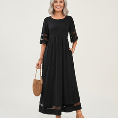 Black midi dress with gathered waist, sheer stripe sleeves, and sheer hem panel