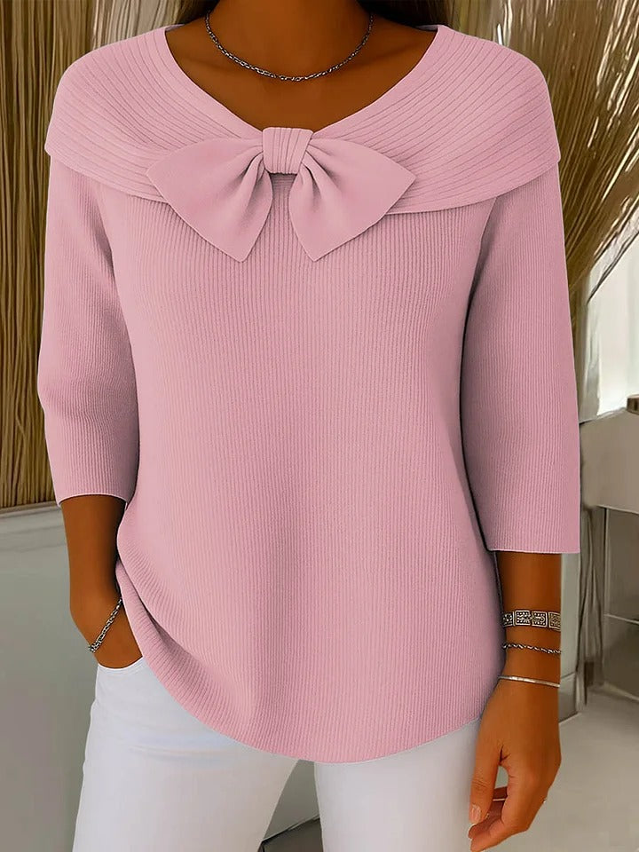 Pink sweater with round neckline bow and three-quarter sleeves