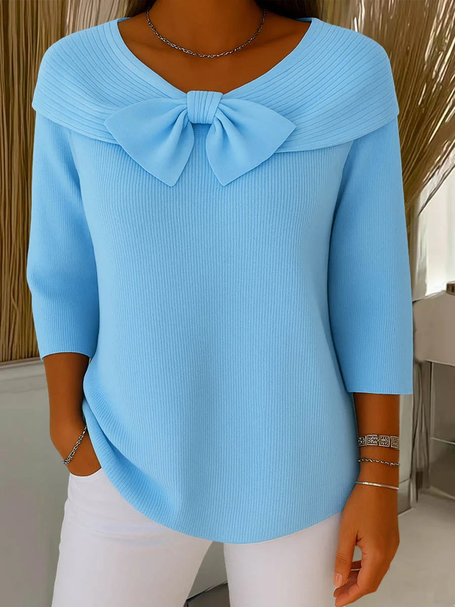 Light blue sweater with round neckline bow and three-quarter sleeves