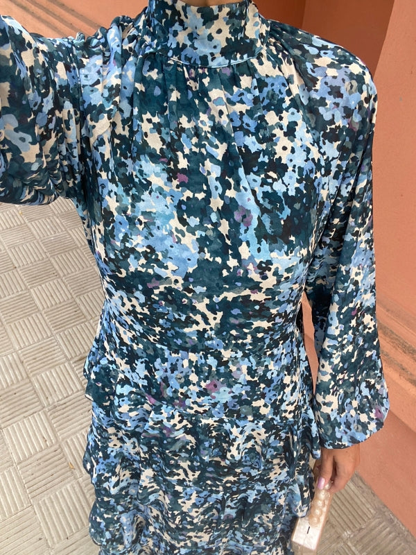 Blue floral long-sleeve dress close-up with high neck and gathered waist detail