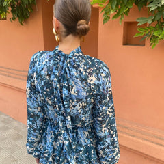 Blue floral midi dress back view with high neck, long sleeves, and tiered hem