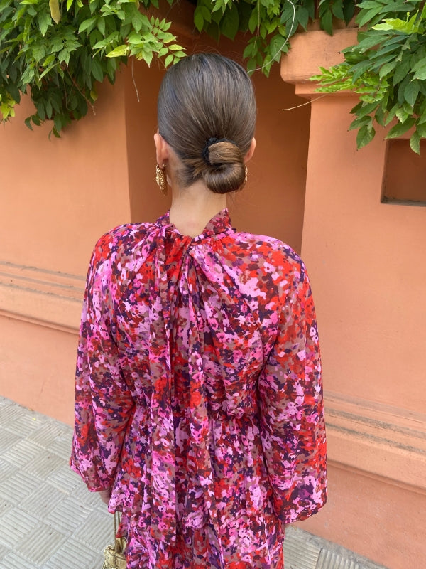 Floral midi dress back view with ruffled high neck and long puff sleeves