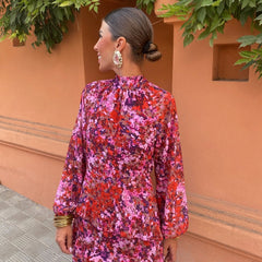 Floral midi dress with ruffled high neck and long sleeves, back view
