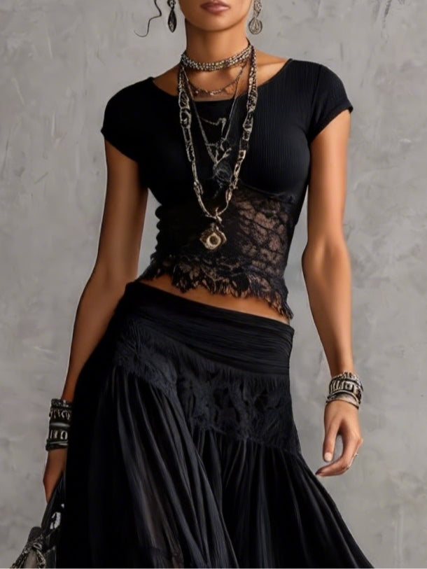 Completo nero con top in pizzo e gonna maxi a balze